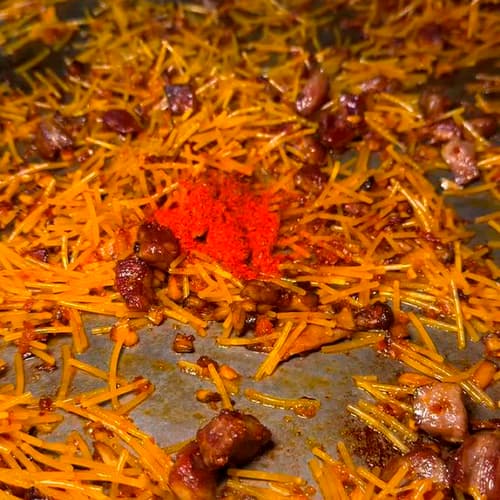  5.- Añadir costillas y alcachofas